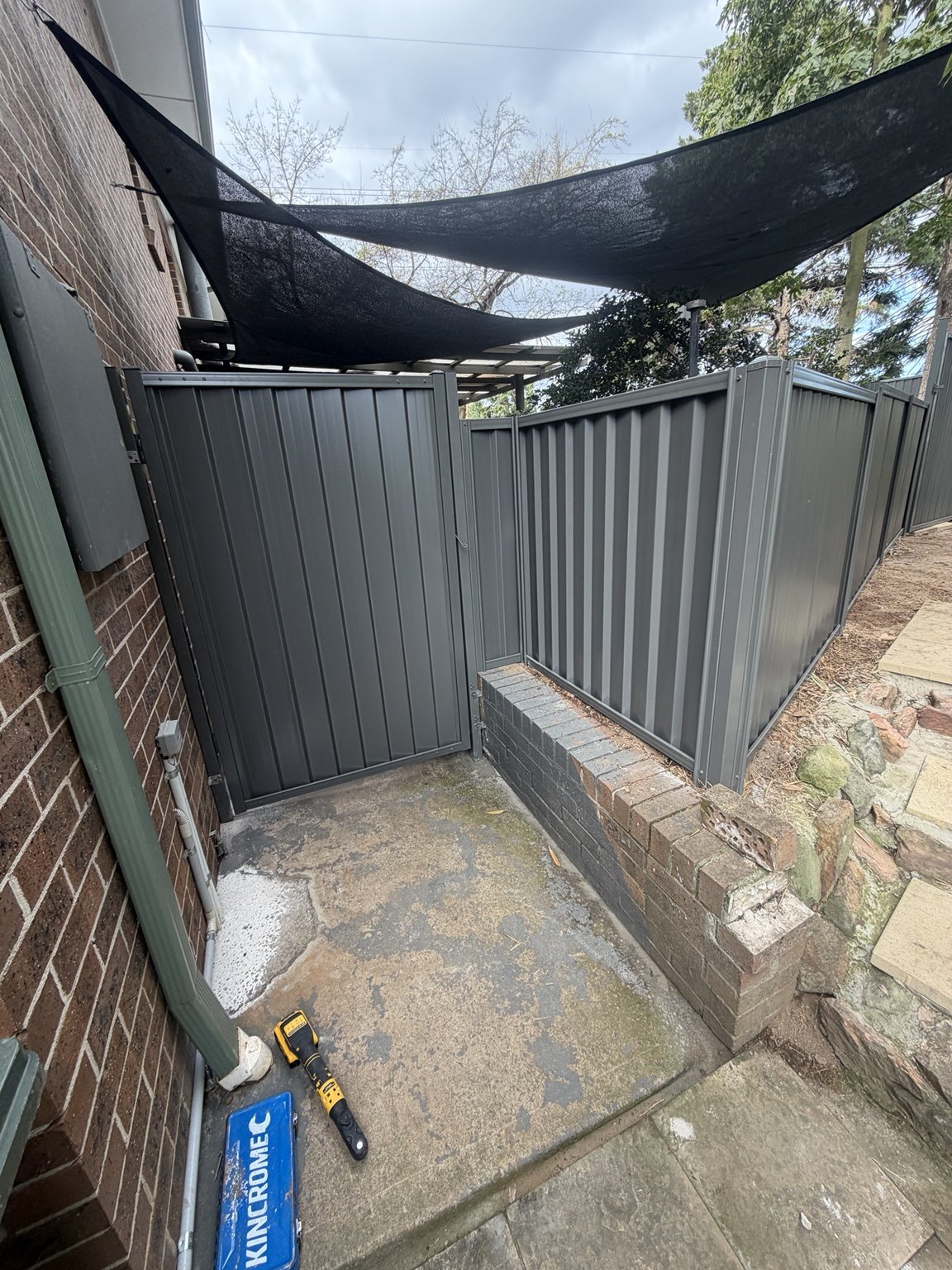 Grey Colorbond fencing around a corner